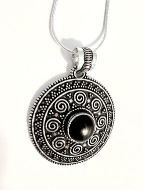 Beautiful, 2 inch, 925 marked, pendant with black Onyx, on a silver chain.